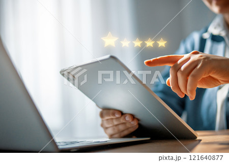 Person is holding a tablet 121640877