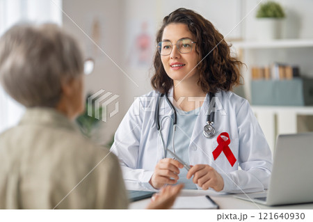 patient and a doctor in medical office 121640930