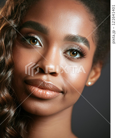 Introspective Beauty with Dark Skin Color in Shadows 121641401