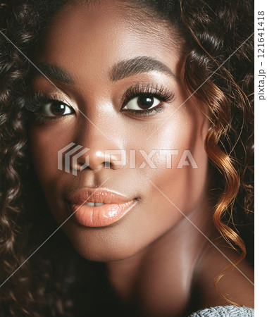 Introspective Beauty with Dark Skin Color in Shadows 121641418