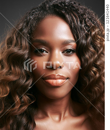 Introspective Beauty with Dark Skin Color in Shadows 121641440
