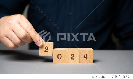 Wooden blocks with the inscription 2024. Setting goals and objectives for the new year. Planning, business management and strategy concept. Trends and ideas. Vision. 121641577