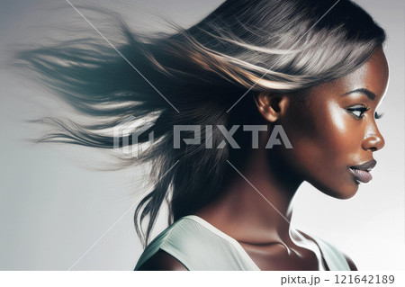 Serene Black and White Portrait of a Windswept Young Woman 121642189