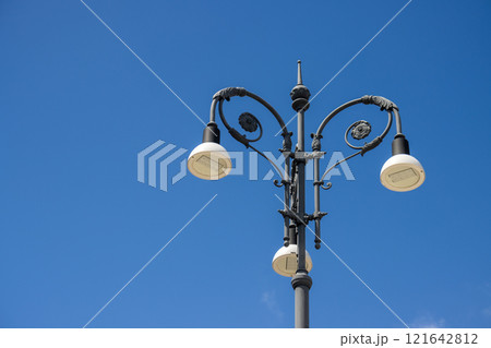 Classic triple old fashioned street lamp, Sicily, Italy Classic triple old fashioned street lamp, Sicily, Italy 121642812