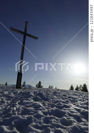 Summit cross of Rechelberg mountain in wintertime, Bavaria, Germany Summit cross of Rechelberg mountain in wintertime, Bavaria, Germany 121643497