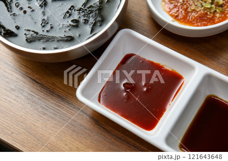 Korean sauce. red chili-pepper paste with vinegar, soy sauce and wasabi Korean sauce. red chili-pepper paste with vinegar, soy sauce and wasabi 121643648