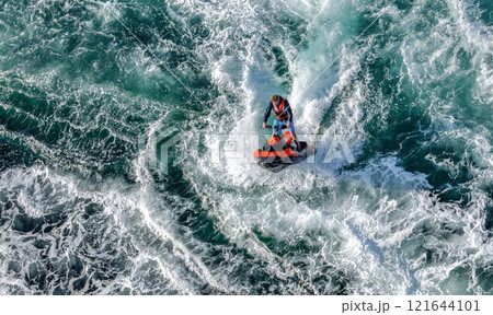 Aerial view of jet skis riding. Whirlpools of the maelstrom of Saltstraumen, Nordland , Norway. Aerial view of jet skis riding. Whirlpools of the maelstrom of Saltstraumen, Nordland , Norway. 121644101