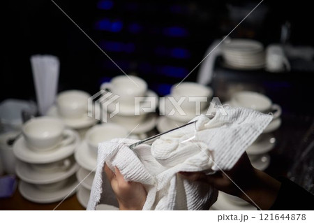 Cleaning glassware effectively in the fast paced environment of a bustling restaurant 121644878