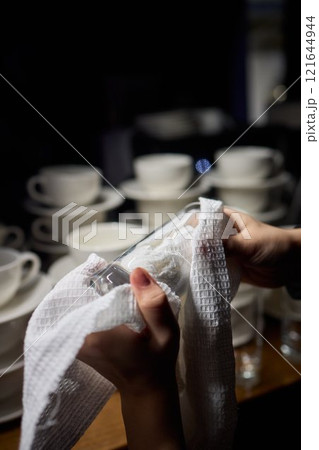 Barista Cleaning Towels Arranged Neatly in a Cozy and Inviting Cafe Setting Atmosphere Barista Cleaning Towels Arranged Neatly in a Cozy and Inviting Cafe Setting Atmosphere 121644944