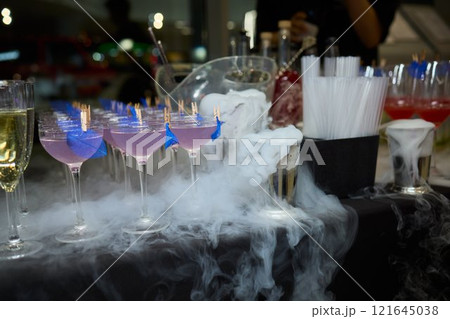An elegant and stunning Champagne Tower adorned with a mysterious and enchanting smoke effect 121645038