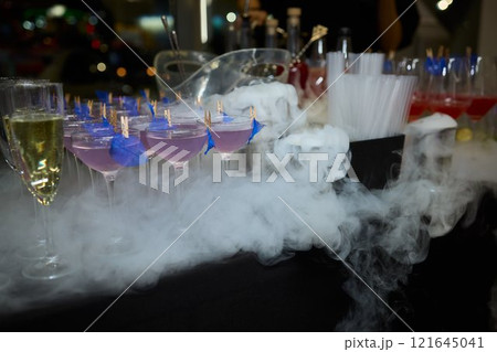 An elegant and stunning Champagne Tower adorned with a mysterious and enchanting smoke effect 121645041