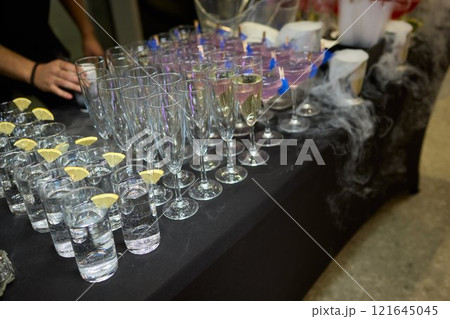 An elegant and stunning Champagne Tower adorned with a mysterious and enchanting smoke effect 121645045
