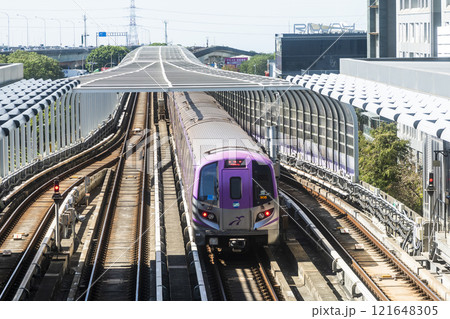View of a Taoyuan International Airport line train running on the elevated track of the Taoyuan Mass Rapid Transit System. 121648305
