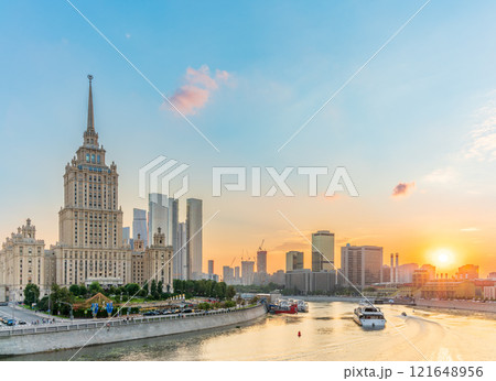High-rise stalinist building near river at summer sunset in Moscow, Russia. Historic name is Hotel Ukraine. High-rise stalinist building near river at summer sunset in Moscow, Russia. Historic name is Hotel Ukraine. 121648956
