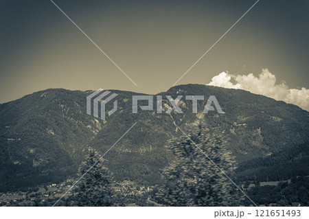 Wonderful wooded mountain alpine panorama with village and huts Austria. Wonderful wooded mountain alpine panorama with village and huts Austria. 121651493