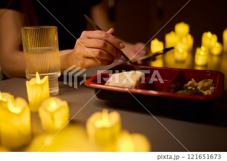 Enjoy a Romantic Candlelit Dining Experience with your Favorite Takeout Meal for Two 121651673