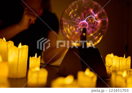Experience a Mystical Scene with an Energy Ball and Candles, evoking Spiritual Vibes Experience a Mystical Scene with an Energy Ball and Candles, evoking Spiritual Vibes 121651703