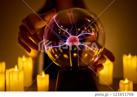 Experience a Mystical Scene with an Energy Ball and Candles, evoking Spiritual Vibes 121651706