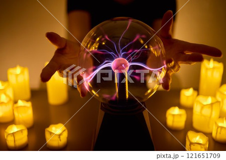 Experience a Mystical Scene with an Energy Ball and Candles, evoking Spiritual Vibes Experience a Mystical Scene with an Energy Ball and Candles, evoking Spiritual Vibes 121651709
