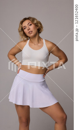 A Sporty Model Wearing Chic Athletic Wear is Posing Confidently with Style and Grace A Sporty Model Wearing Chic Athletic Wear is Posing Confidently with Style and Grace 121652400