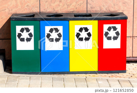 Multicolored containers for separate collection of waste. Separate garbage containers according to waste type Multicolored containers for separate collection of waste. Separate garbage containers according to waste type 121652850