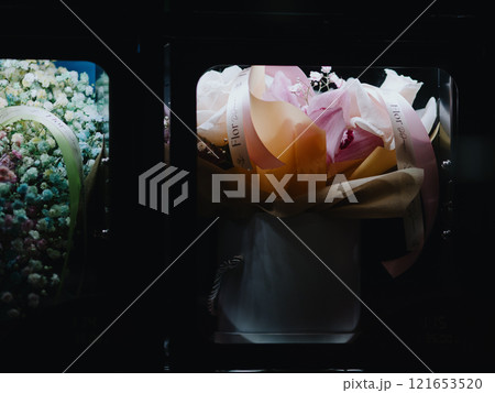 Bouquets of flowers in the cells of a flower vending machine. Self-service machine for selling gift bouquets of fresh flowers. Vending machine. Small business. December 31, 2024 - Pula, Croatia 121653520