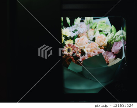 Bouquets of flowers in the cells of a flower vending machine. Self-service machine for selling gift bouquets of fresh flowers. Vending machine. Small business. December 31, 2024 - Pula, Croatia 121653524
