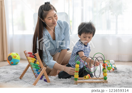 Asian Mother and Child Playing with Educational Toys at Home 121659314
