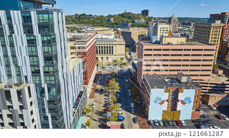 Aerial Urban Contrast Cincinnati Architecture with Green Hillside 121661287