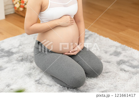 Happy Pregnant Asian Woman sitting on bed holding and stroking her big belly at home,Pregnancy of young woman enjoying with future life relax at home,Motherhood and Pregnant Concept,Soft focus Happy Pregnant Asian Woman sitting on bed holding and stroking her big belly at home,Pregnancy of young woman enjoying with future life relax at home,Motherhood and Pregnant Concept,Soft focus 121661417