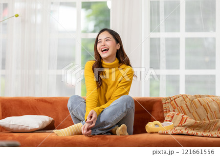 Beautiful asian young woman smile and cheerful. Confident cute female looking at camera relax and happiness with wellness life. good moment and positive emotional. Happy woman enjoy her life concept 121661556