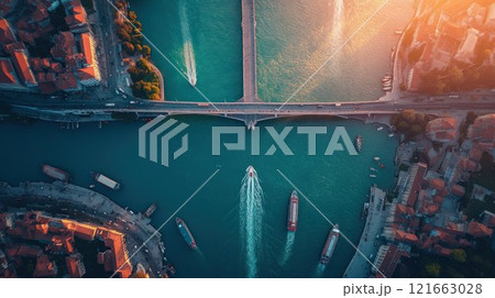 Aerial view of a river with bridges and boats. Aerial view of a river with bridges and boats. 121663028