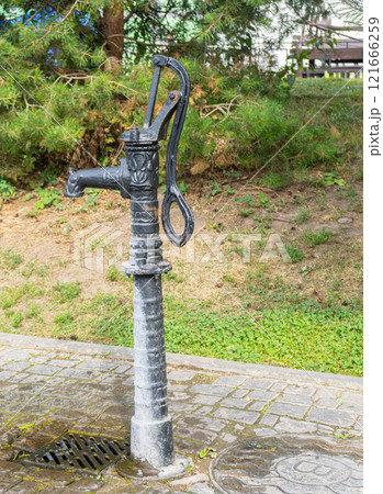 Street sculpture of water tap, Retro water column. Vladimir. High quality photo 121666259