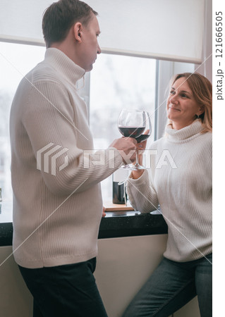 happy couple with glasses of wine happy couple with glasses of wine 121666505