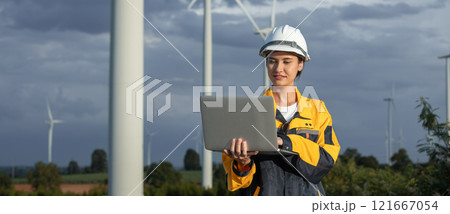 Female engineer wind turbine worker survey operational planning windmill clean renewable energy technology for future. Alternative technology protect environment reduce global warming problems. 121667054