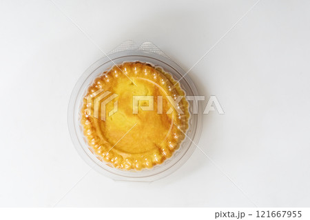 Round butter bun enclosed in plastic packaging on white background Round butter bun enclosed in plastic packaging on white background 121667955