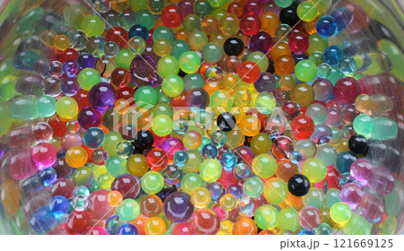 Heap Of Multicolor Water Balls On Curved Steel Surface Heap Of Multicolor Water Balls On Curved Steel Surface 121669125