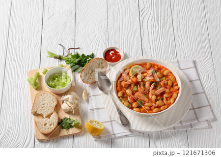 Pasulj, white bean soup with chicken in bowl 121671306