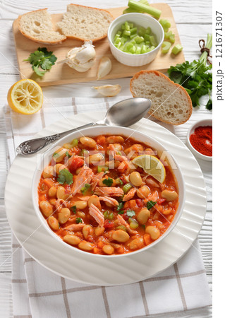 Pasulj, white bean soup with chicken in bowl 121671307