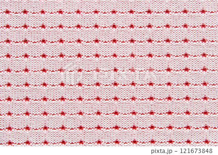 Red and white dotted pattern on knitted fabric background with repeating Red and white dotted pattern on knitted fabric background with repeating 121673848