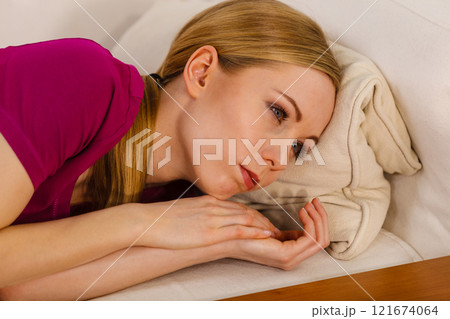 Sad depressed woman lying on bed Sad depressed woman lying on bed 121674064