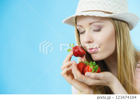 Young woman with fresh strawberry Young woman with fresh strawberry 121674104