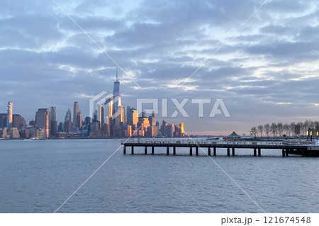 View of the skyscrapers of Manhattan from the water, New York landscape from the waterfront View of the skyscrapers of Manhattan from the water, New York landscape from the waterfront 121674548
