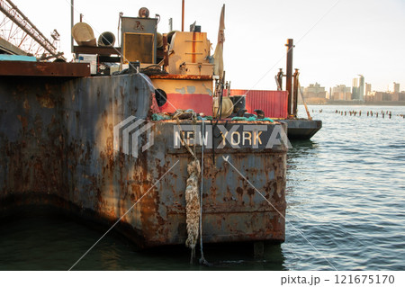 Old rusty barge ladder moored in New York City Old rusty barge ladder moored in New York City 121675170