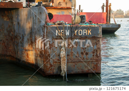 Old rusty barge ladder moored in New York City Old rusty barge ladder moored in New York City 121675174