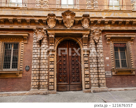 Views of city of Bologna in Italy. facades houses are bright terracotta shades Views of city of Bologna in Italy. facades houses are bright terracotta shades 121676357