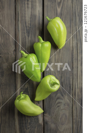 fresh green sweet (capsicum) pepper. Homemade green pepper with green leaves .bell pepper, Freshly harvested peppers 121676723