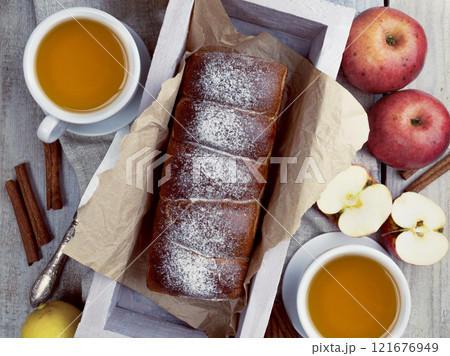 Tea Party Ready: Warm Autumn Apple Pie with Sweet Pastries, Evoking a Delightful Autumn Mood. Flat lay. Tea Party Ready: Warm Autumn Apple Pie with Sweet Pastries, Evoking a Delightful Autumn Mood. Flat lay. 121676949