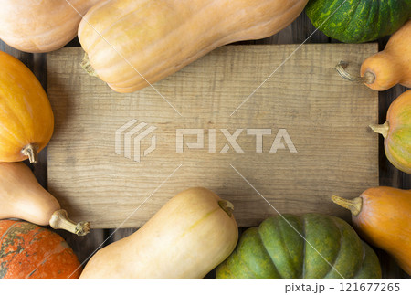 Autumn pumpkins and leaves on a wooden table.Autumn pumpkin thanksgiving background with pumpkins.Halloween.Thanksgiving Autumn pumpkins and leaves on a wooden table.Autumn pumpkin thanksgiving background with pumpkins.Halloween.Thanksgiving 121677265