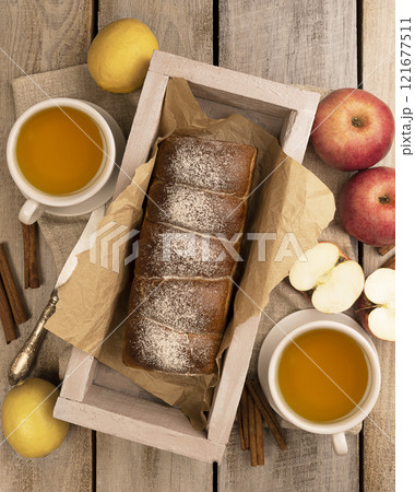 Autumn Tea Party Spread with Delicious Apple Pie and Sweet Pastries, Embracing the Cozy and Warm Autumn Atmosphere. Flat lay. 121677511